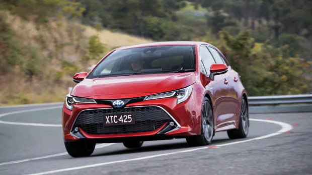 2019 Toyota Corolla ZR hybrid Volcanic Red front 3/4 cornering