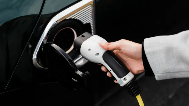 Ev chargers plug in hand