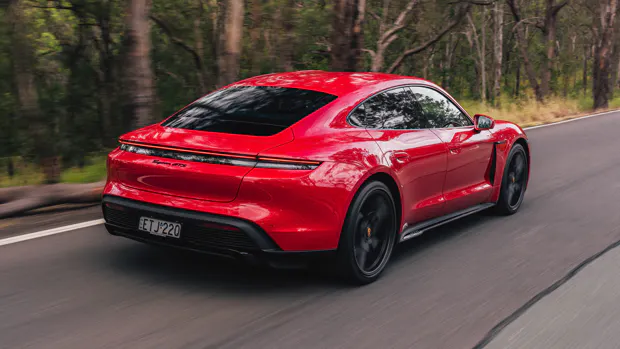 2022 Porsche Taycan GTS sedan red - dynamic rear 3/4 shot