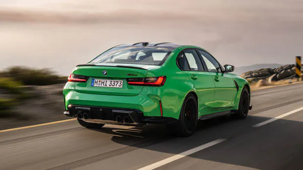 2023 BMW M3 CS rear 3/4 view driving shot