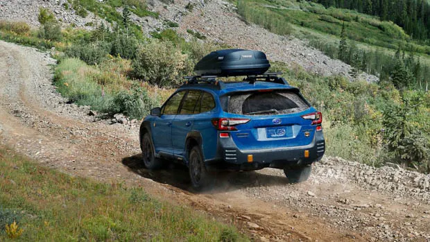 2022 Subaru Outback wilderness going down a trail