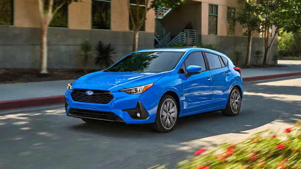 2024 Subaru Impreza driving front 3/4
