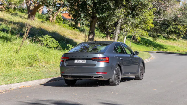 Skoda Superb 206TSI Sportline 2023 driving rear 3/4 3