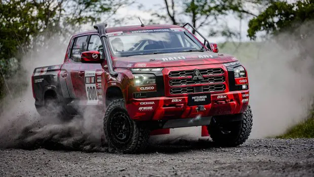 2024 Mitsubishi Triton AXCR rally ute front 3/4 4 dust