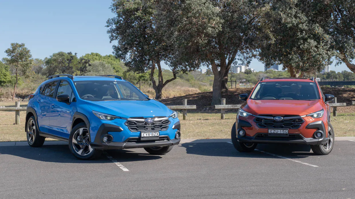 2023 Subaru Crosstrek Hybrid S with orange Crosstrek 2.0S shot 2