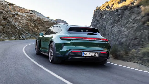 2024 Porsche Taycan Turbo Cross Turismo rear end driving shot