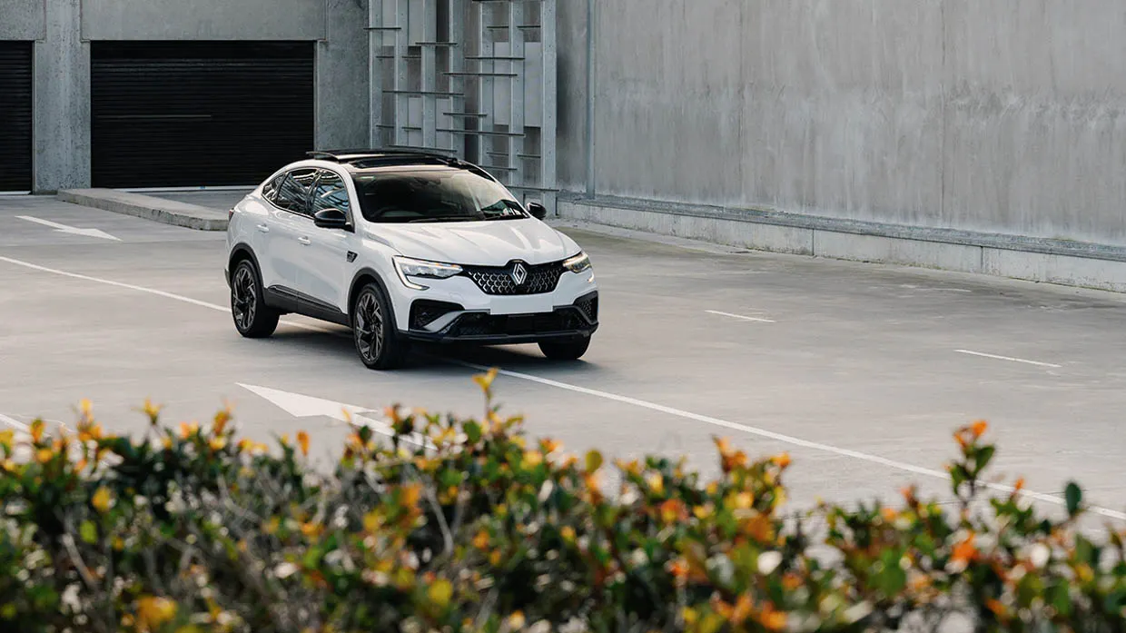 2024 Renault Arkana Esprit Alpine wide front angle shot bush