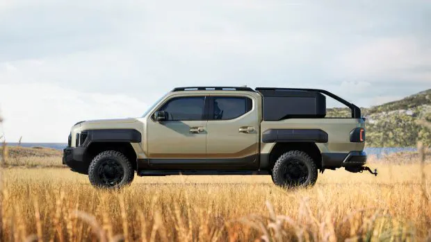 2025 Kia Tasman side angle with rear canopy