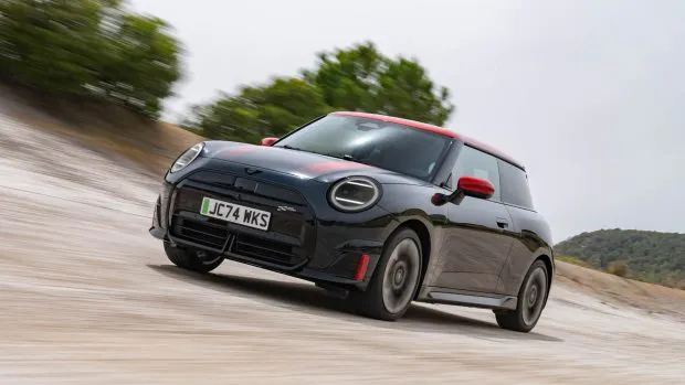 2025 Mini Cooper JCW electric hatch front 3/4 driving shot