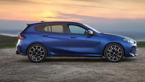 2025 BMW M135 xDrive side angle exterior sunset