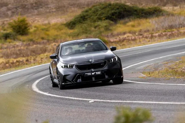 BMW M5 sedan 2025 driving front 3