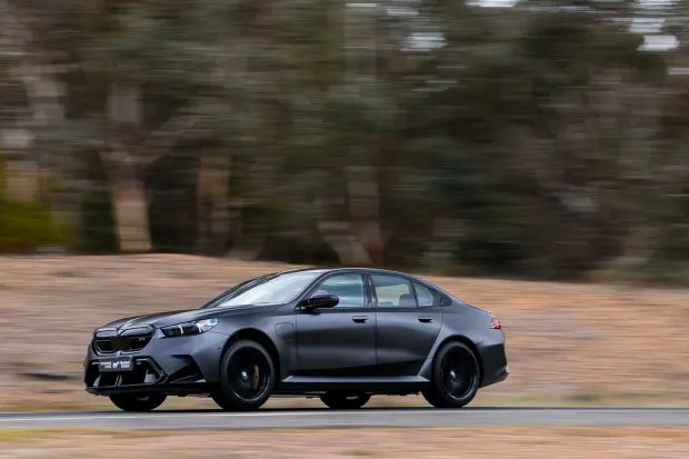 BMW M5 sedan 2025 driving